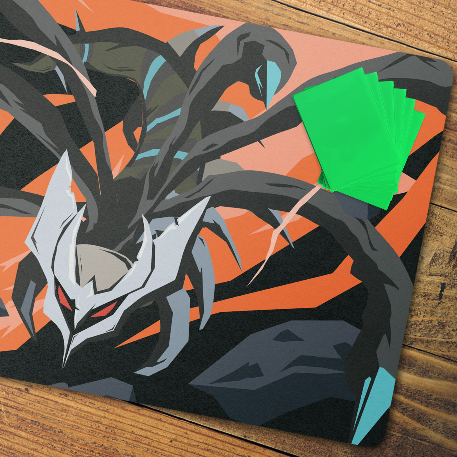 A square gaming playmat featuring a stylized dark dragon illustration in black, gray, and orange, with a fanned stack of bright green cards placed on the top right, set on a wooden surface.